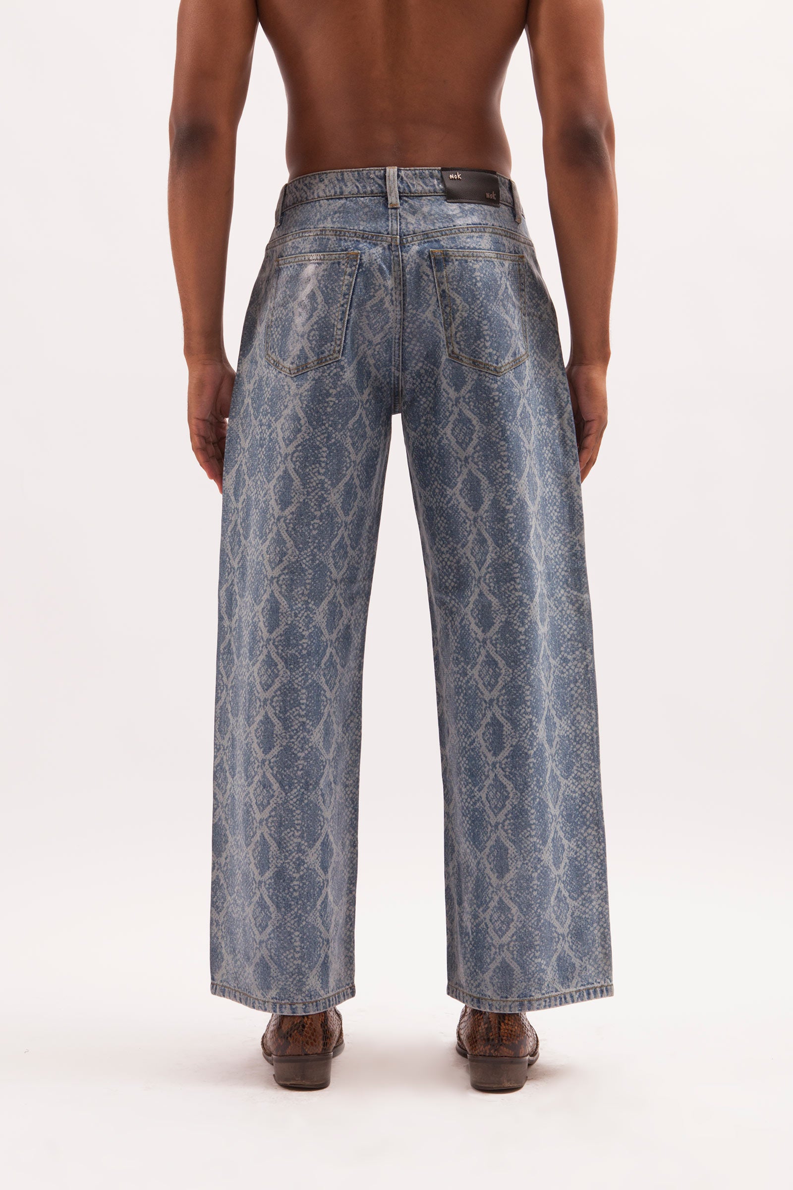 SOPHISTICATED- BAGGY FIT SNAKE SKIN LASER PRINT COATED JEANS – Nok